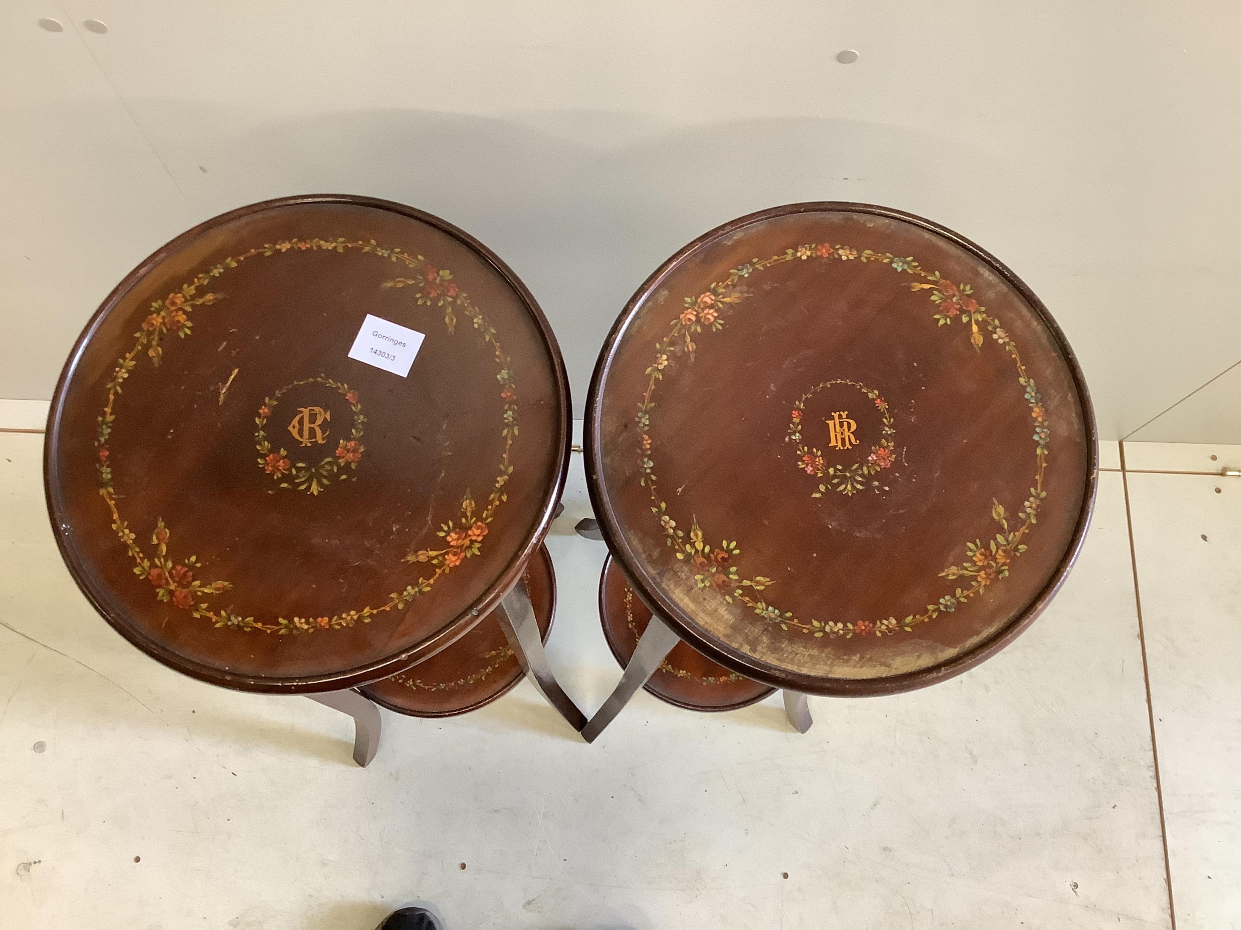 A pair of Sheraton Revival painted mahogany two tier plant stands, diameter 33cm, height 95cm. Condition - fair